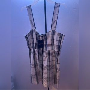 This mini dress is new, never used. Has tag.Size Large, does run a little small.